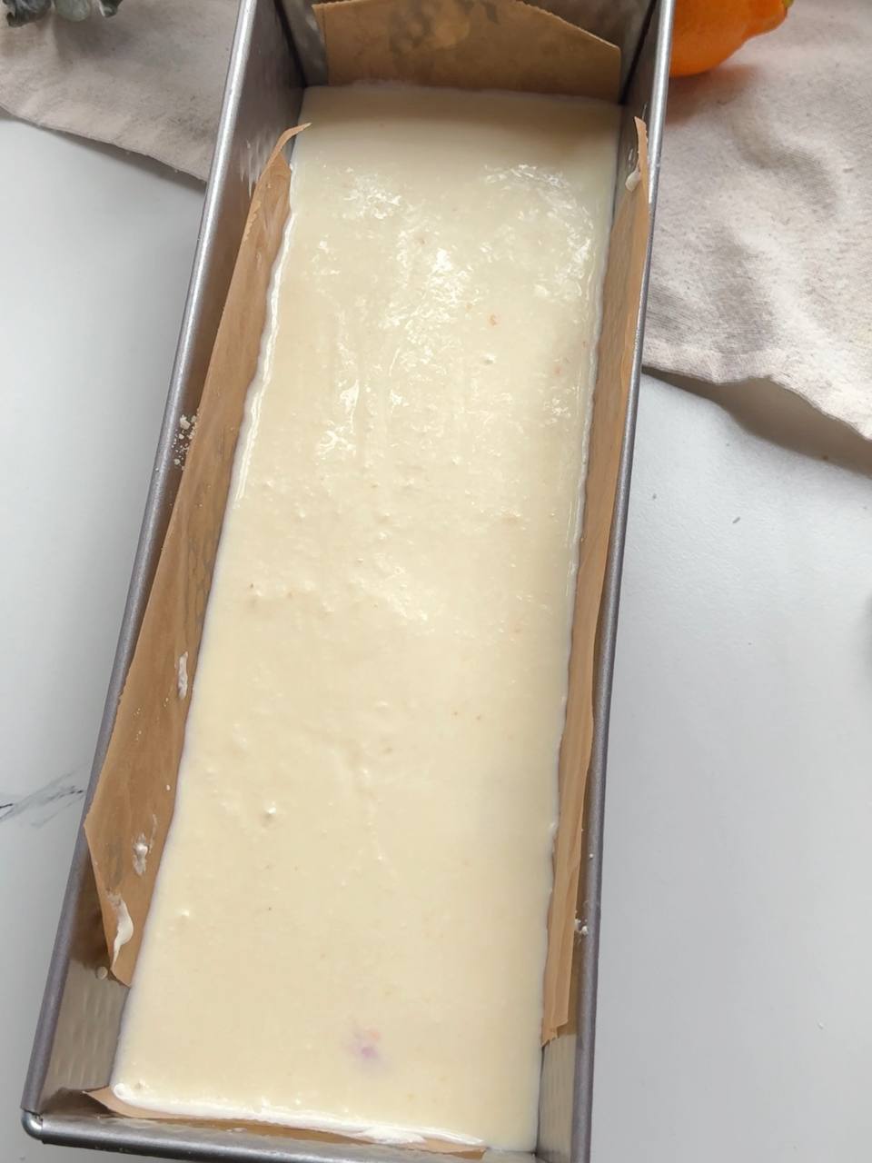 spreading the cottage cheese filling over the crumble base