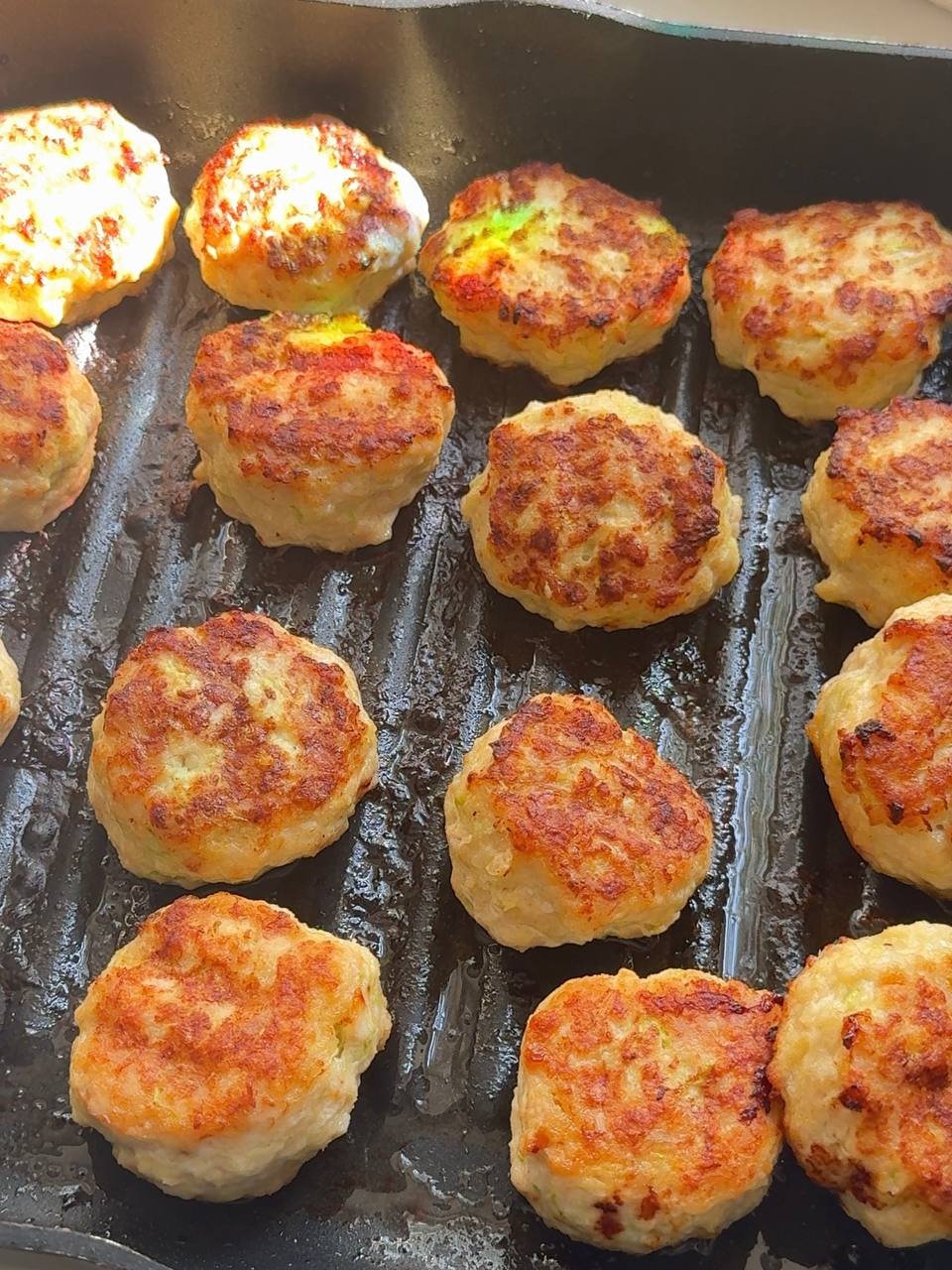 crispy chicken zucchini patties after baking in the oven