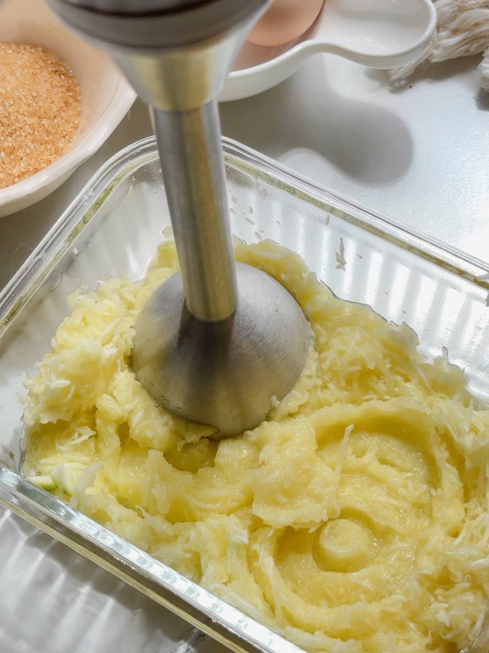 blending grated zucchini into a smooth purée