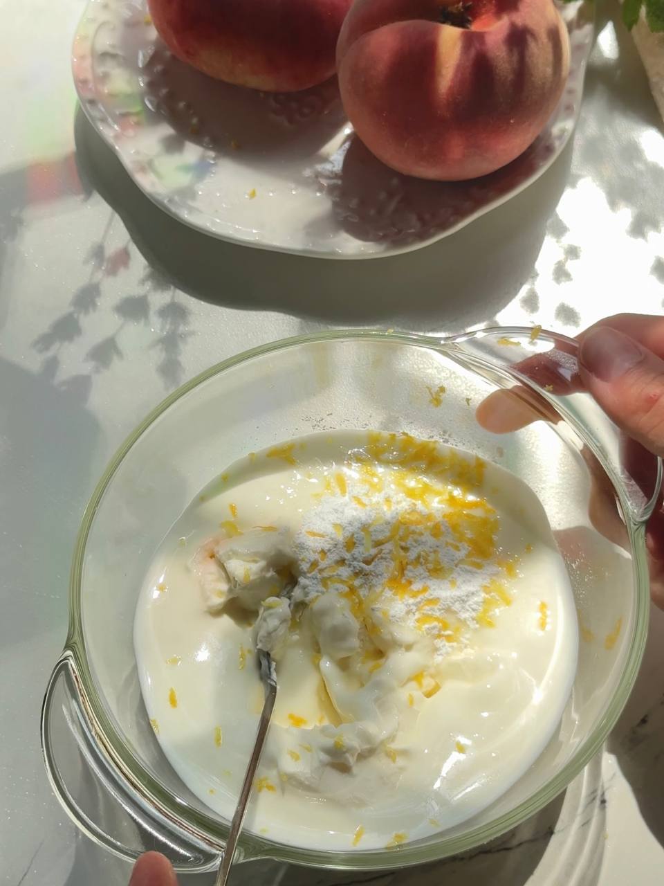 cream cheese, Greek yogurt, powdered sugar, vanilla, and lemon zest in a mixing bowl