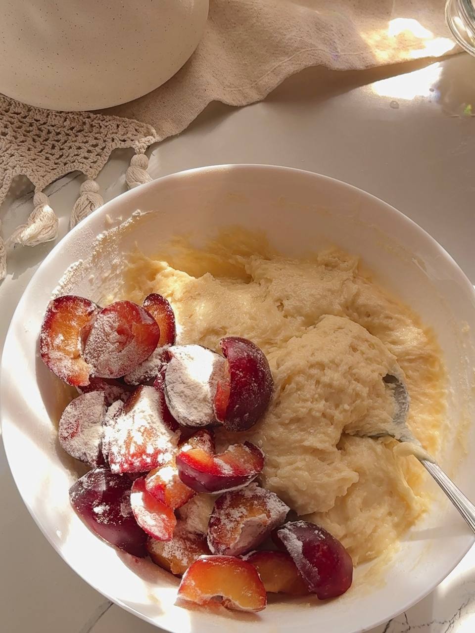 Fresh plum pieces coated with flour