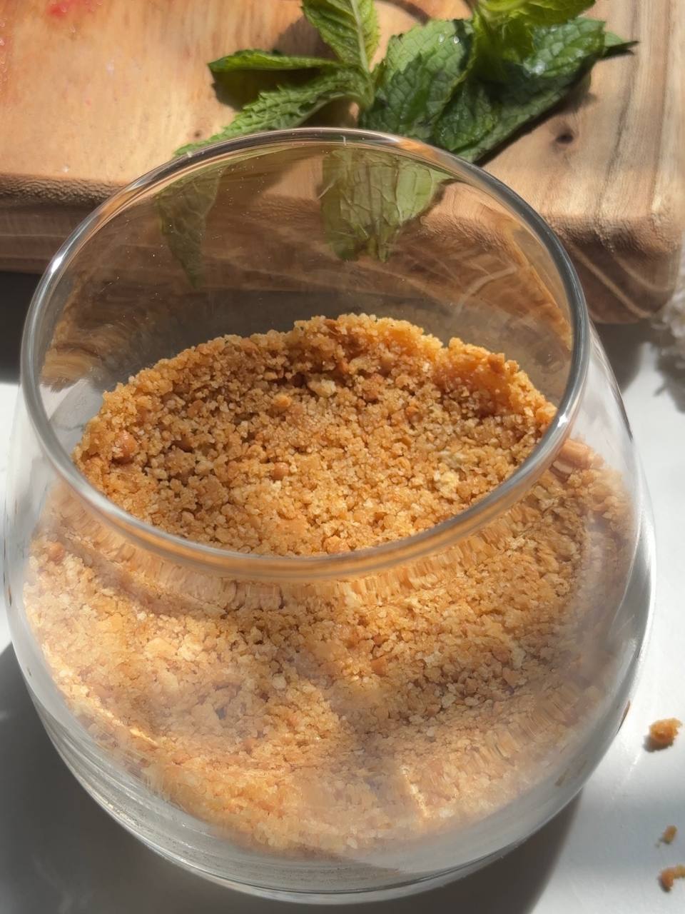 cookie crust pressed into the bottom of a dessert glass