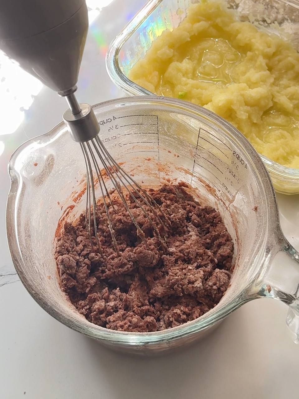 mixing the chocolate brownie batter until combined
