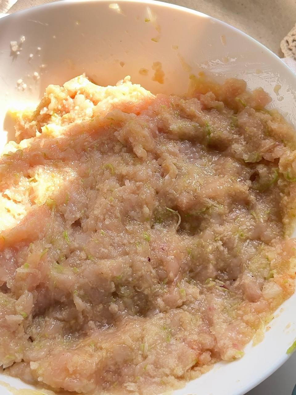 mixing the chicken zucchini patty mixture until well combined