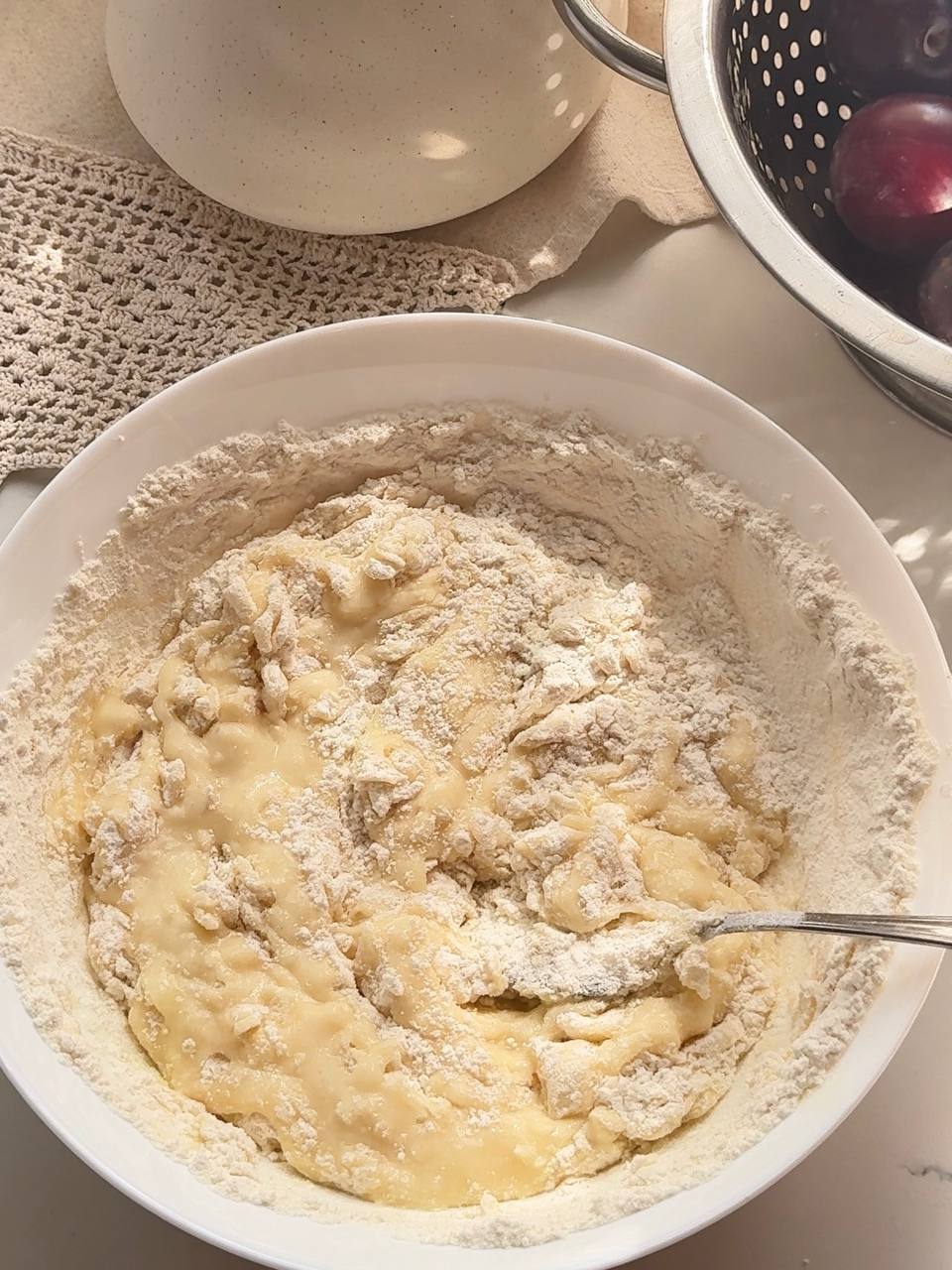 Mixing flour and baking powder into the batter