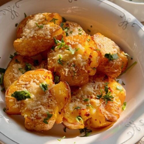 crispy smashed potatoes served with garlic yogurt sauce and fresh parsley