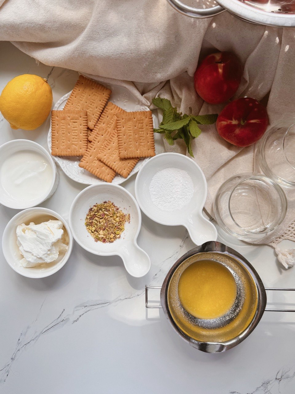 Alt text: ingredients for no-bake peach cheesecake cups