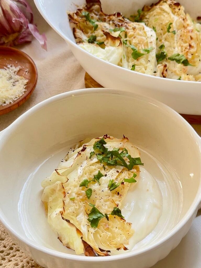 roasted cabbage steaks served with garlic lemon Greek yogurt sauce