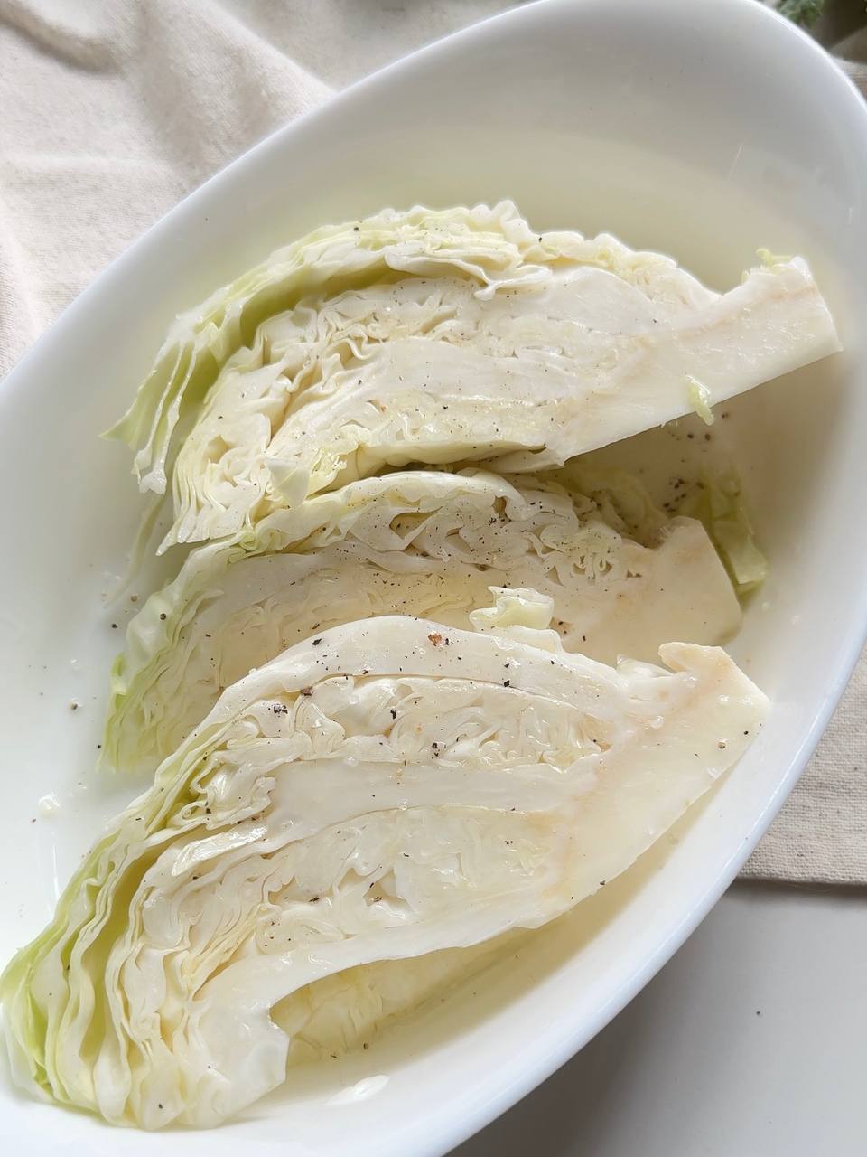 cabbage steaks seasoned with olive oil, salt, and black pepper