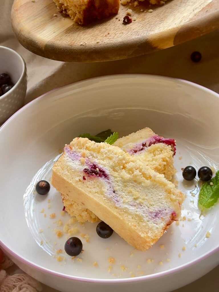 blackcurrant cottage cheese crumble cake served with fresh blackcurrants and mint