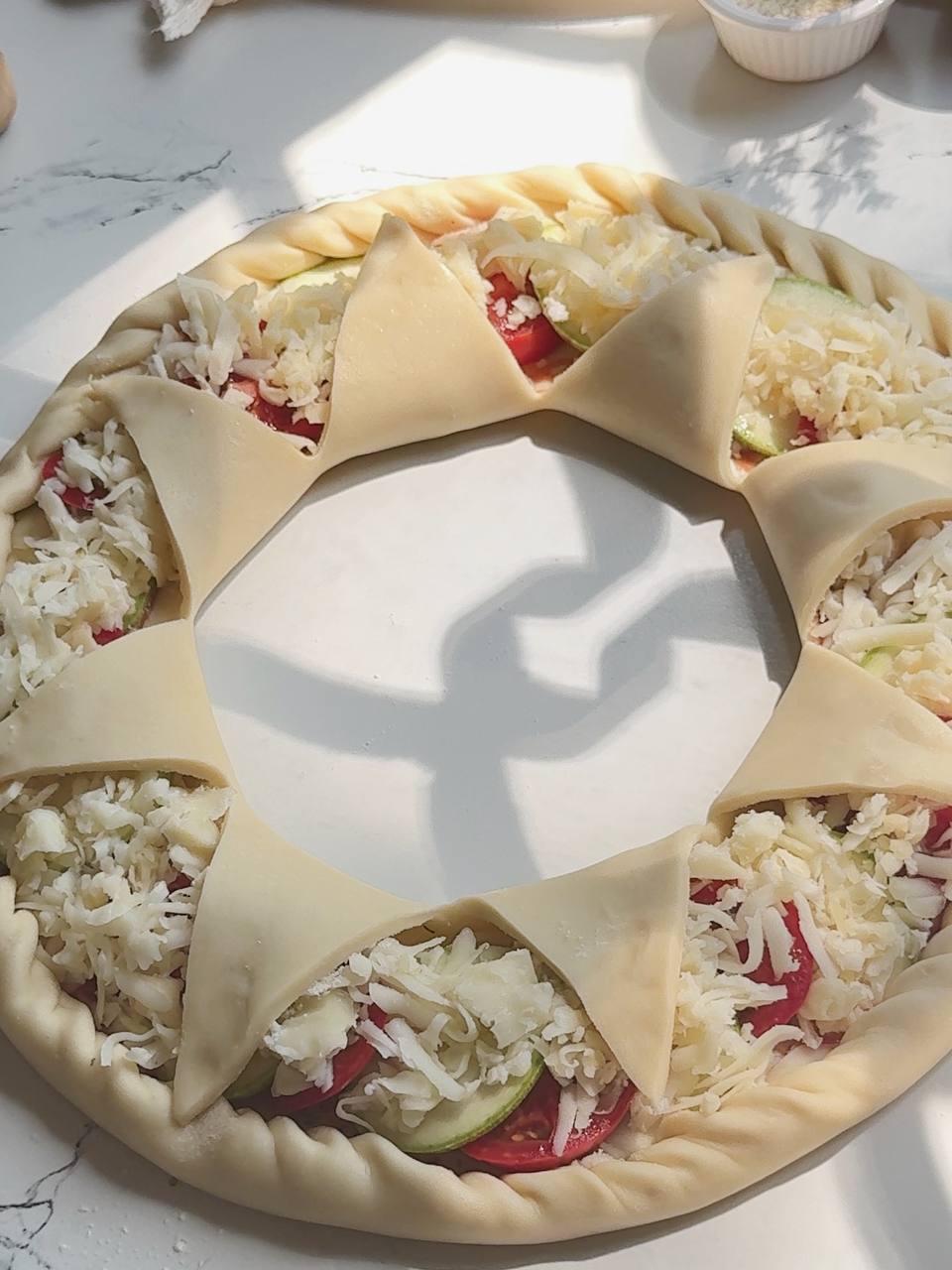 shaping the center of the zucchini puff pastry ring tart