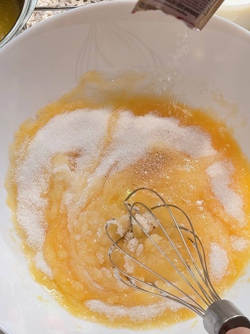 Whisking eggs and sugar for Greek yogurt plum cake