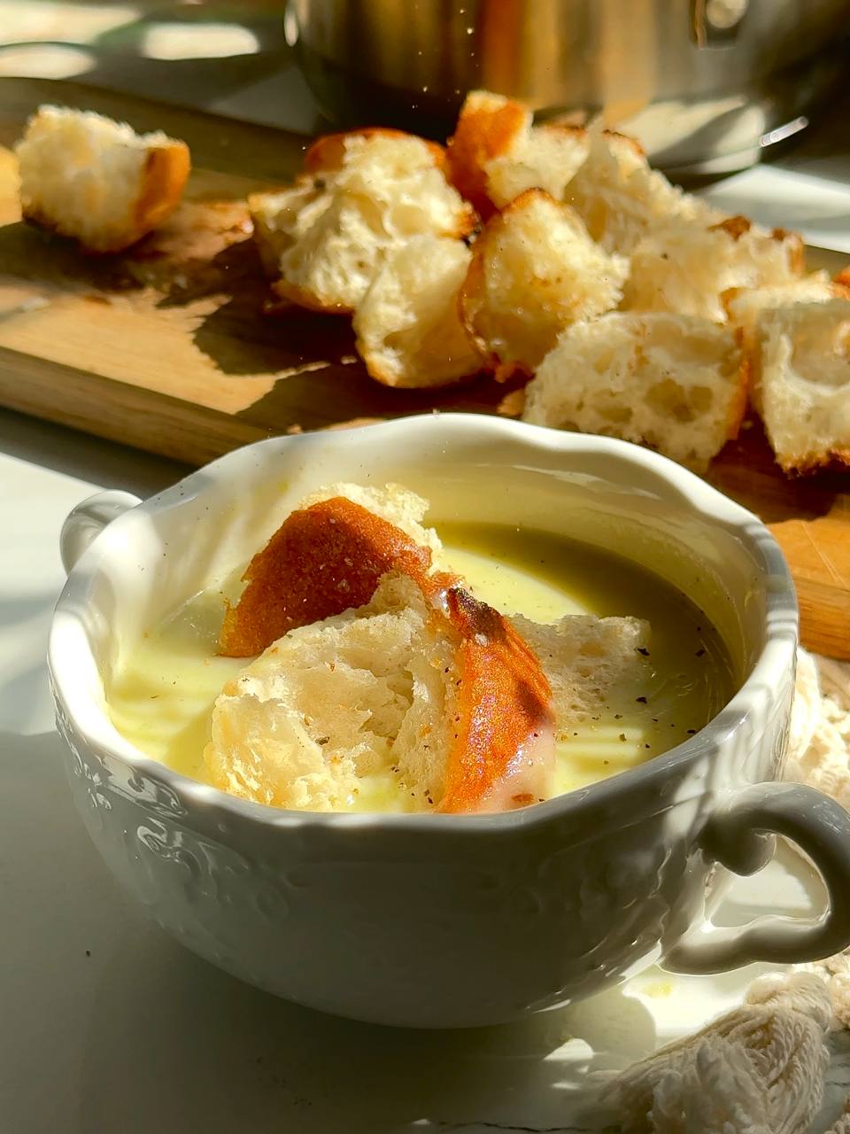 cream cheese zucchini soup served with crispy garlic croutons