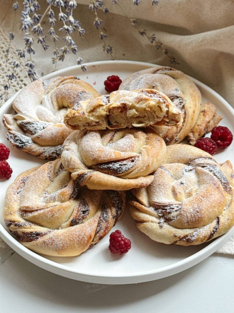 Cottage cheese buns with blackcurrant jam dusted with powdered sugar
