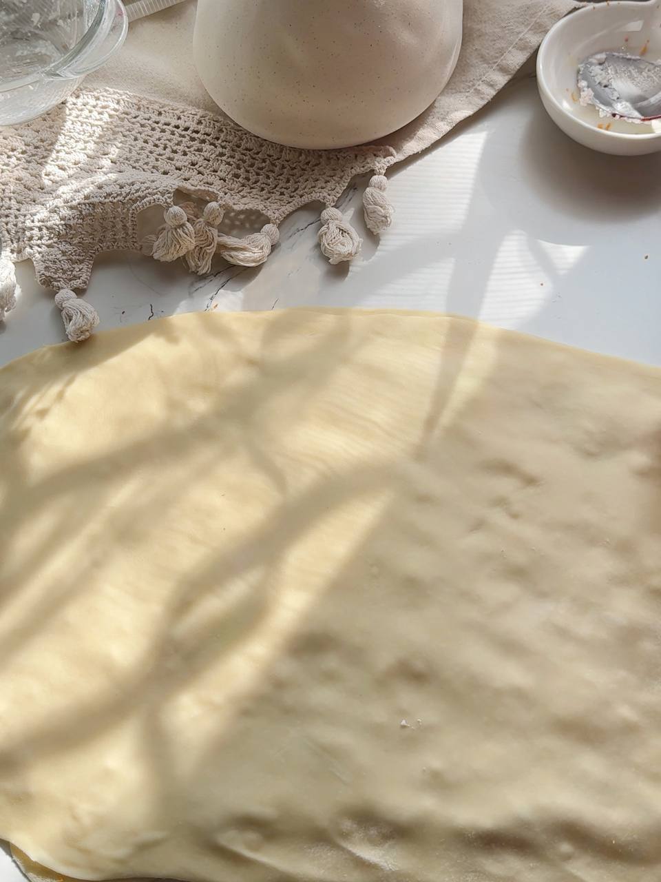 Second sheet of puff pastry placed over the cottage cheese and jam filling