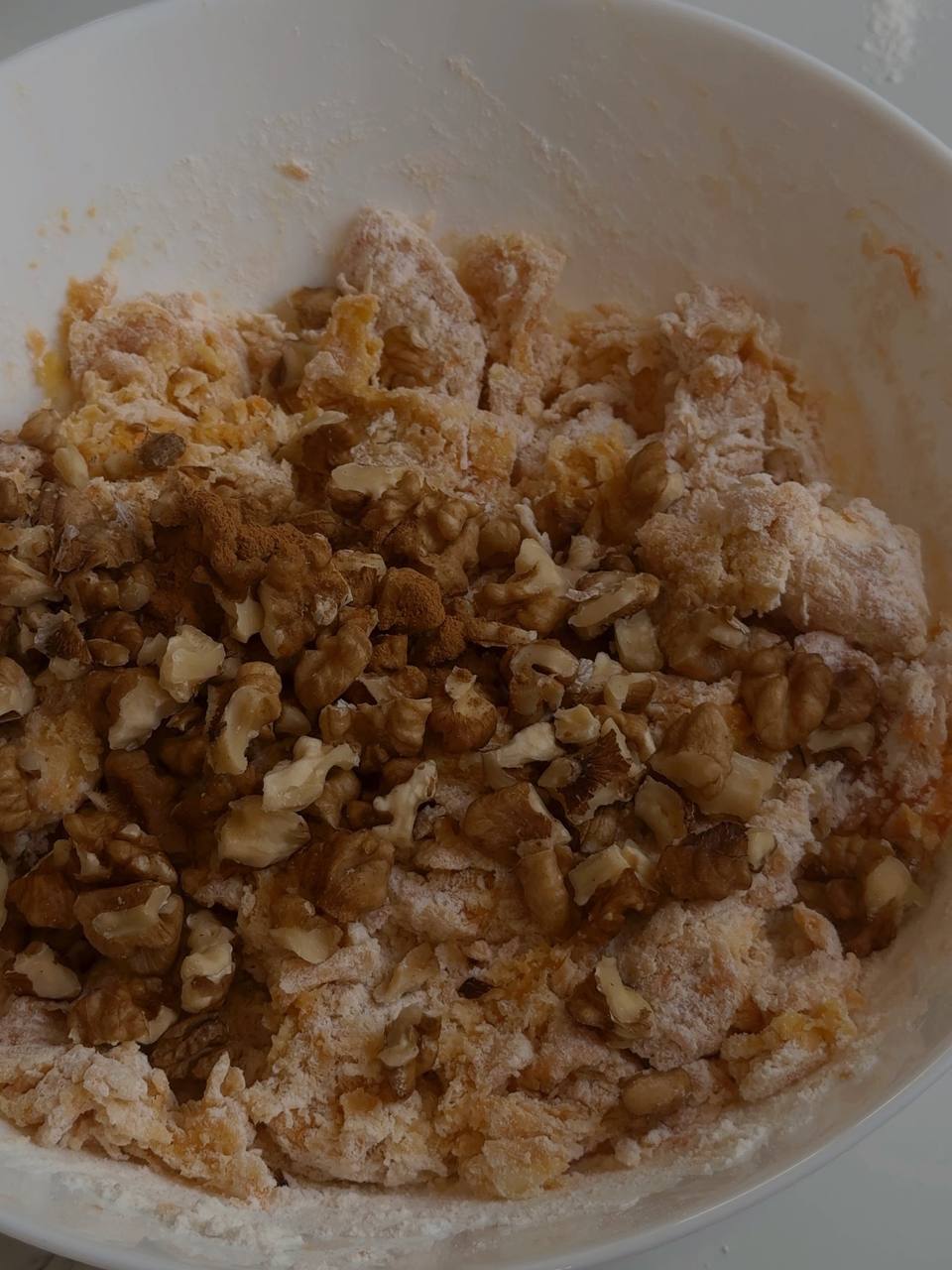 Chopped walnuts added to the carrot cake cookie dough