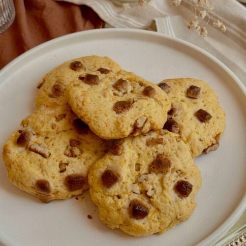 Homemade carrot cake cookies with walnuts and white chocolate served on a plate