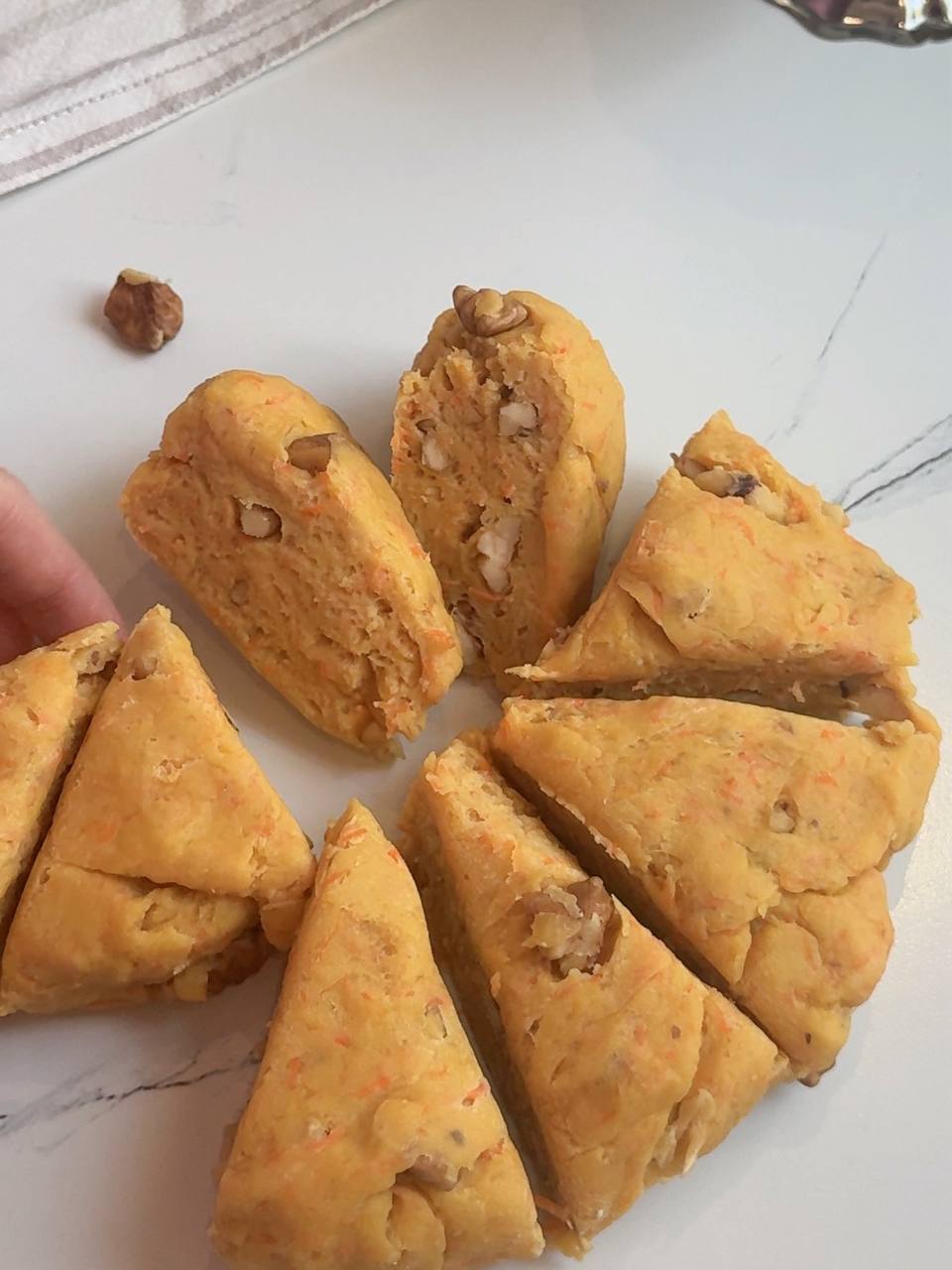 Carrot cake cookie dough divided into eight portions before shaping