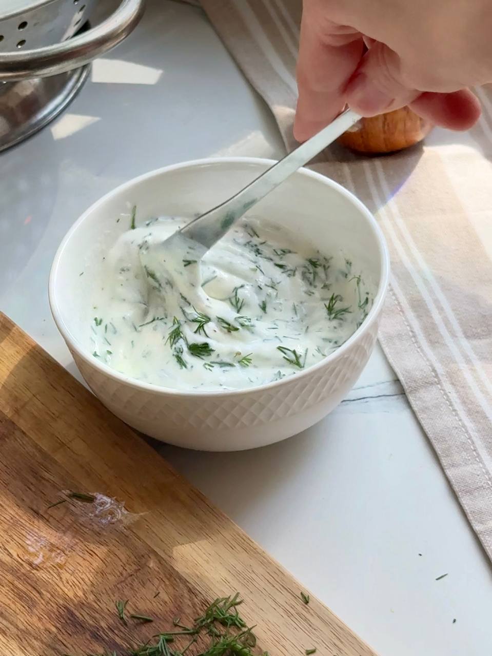 Greek yogurt dill sauce with fresh dill and lemon for serving with salmon